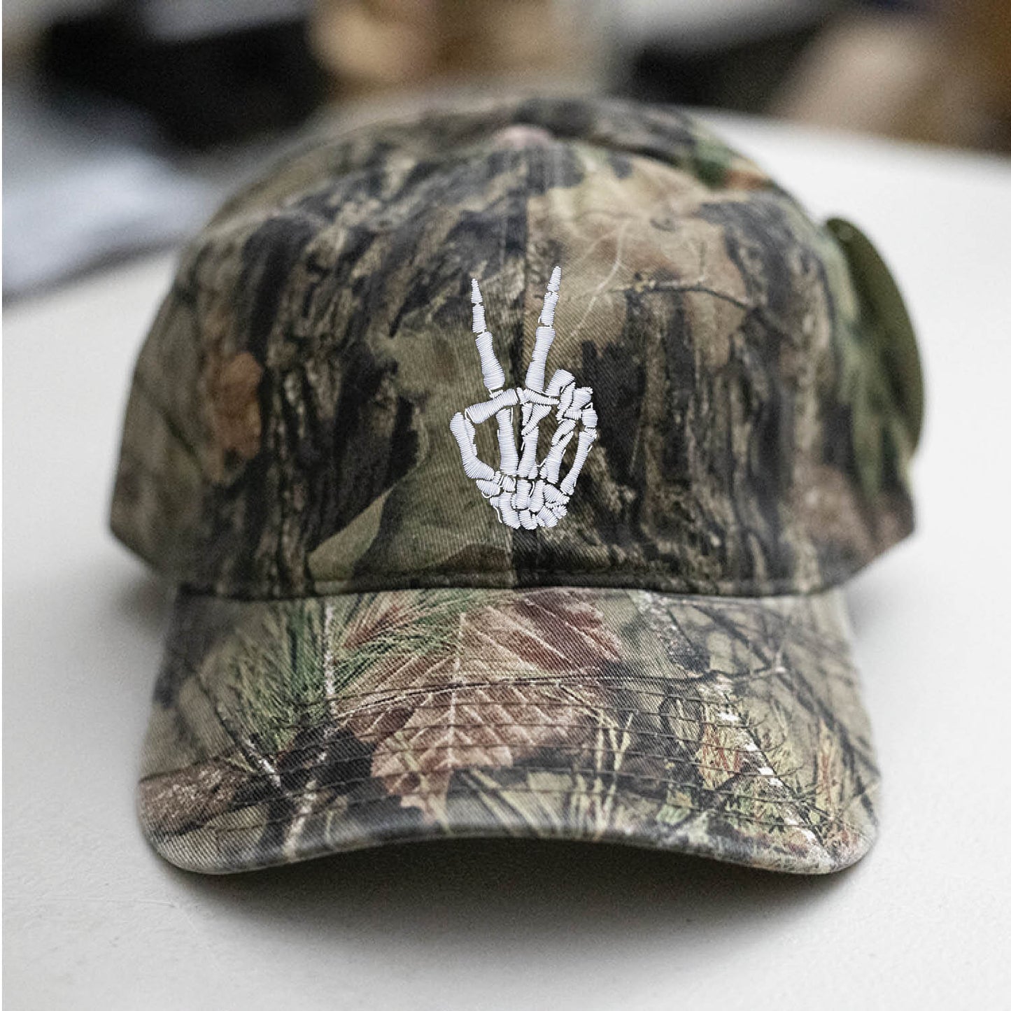 Skeleton Hand Peace Sign Mossy Oak Camo Hat Embroidered