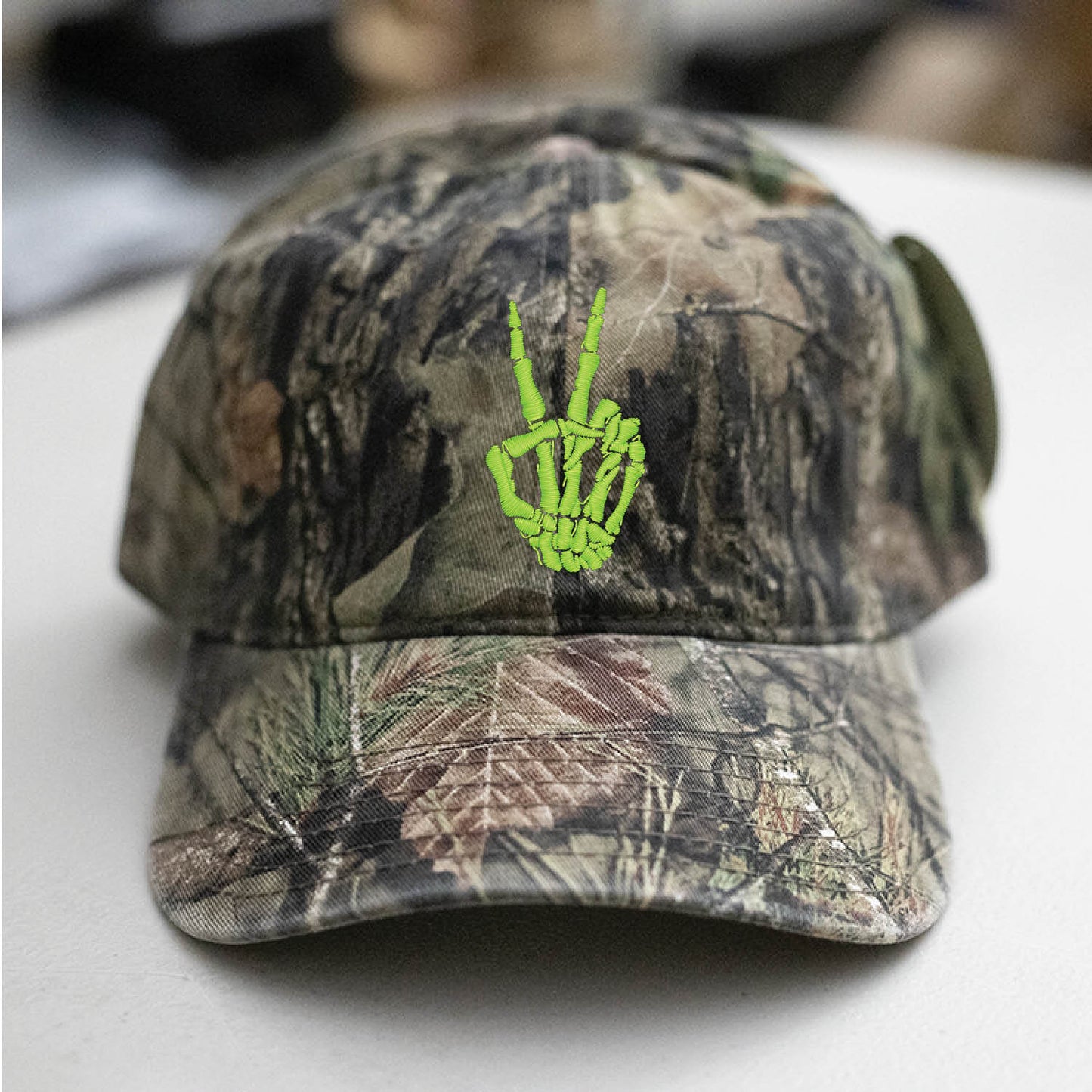 Skeleton Hand Peace Sign Mossy Oak Camo Hat Embroidered