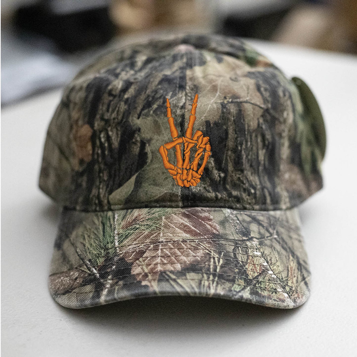 Skeleton Hand Peace Sign Mossy Oak Camo Hat Embroidered
