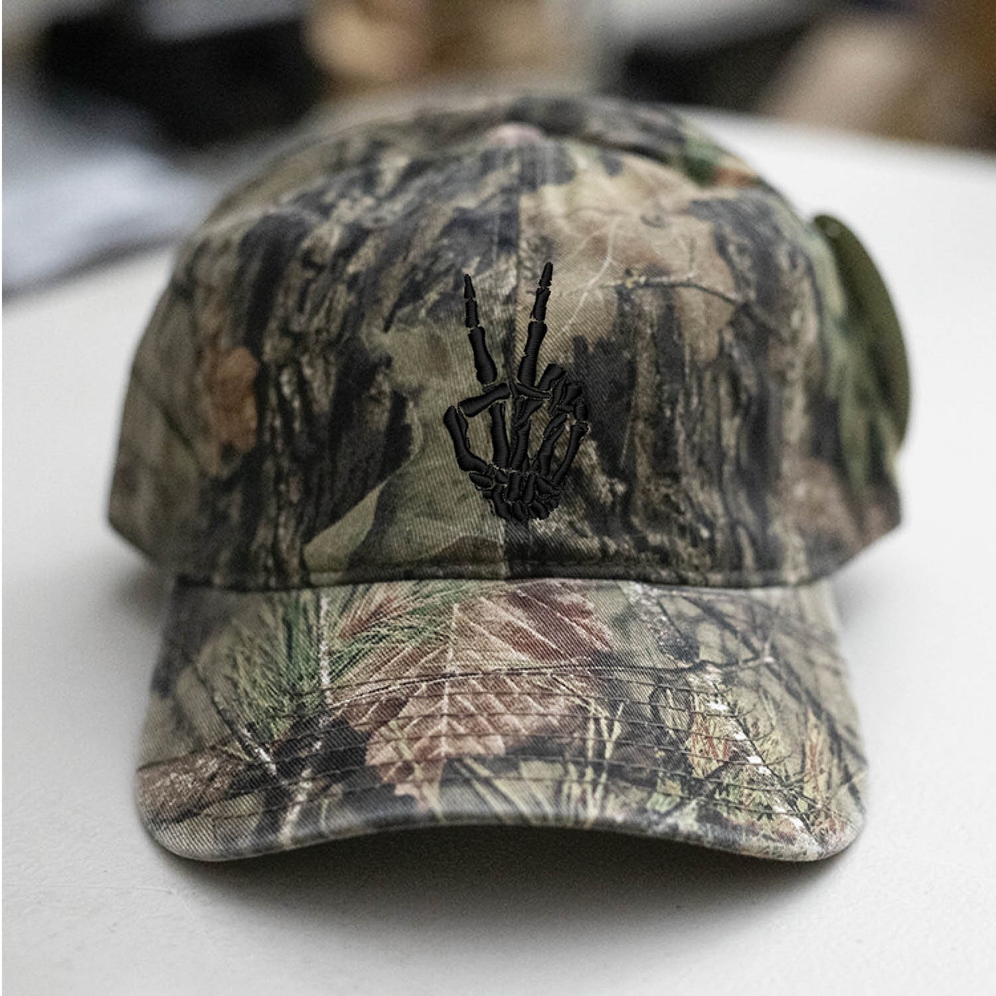 Skeleton Hand Peace Sign Mossy Oak Camo Hat Embroidered