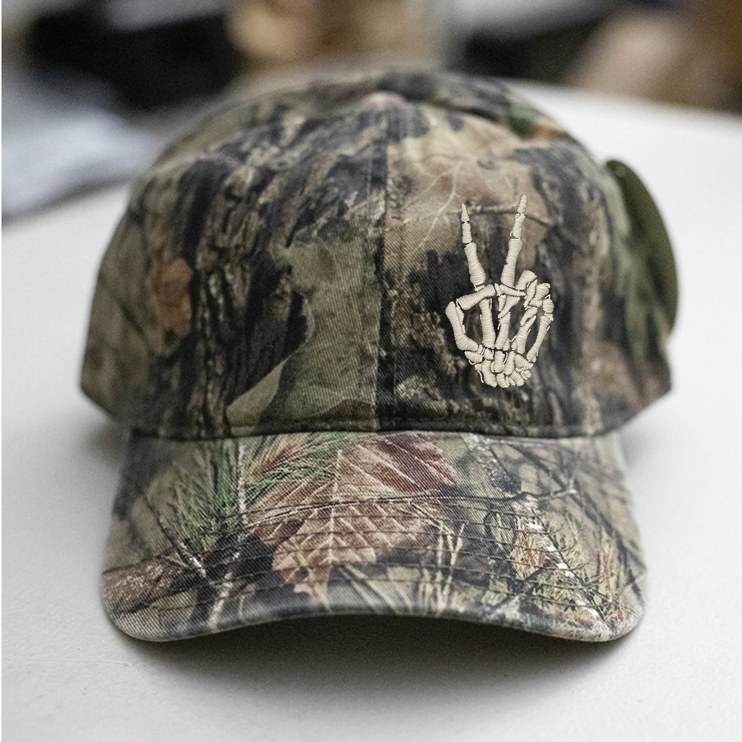 Skeleton Hand Peace Sign Mossy Oak Camo Hat Embroidered